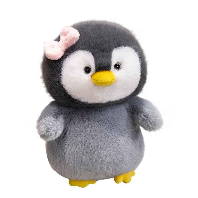 Bow penguin plush toy with soft plush fabric and rounded design