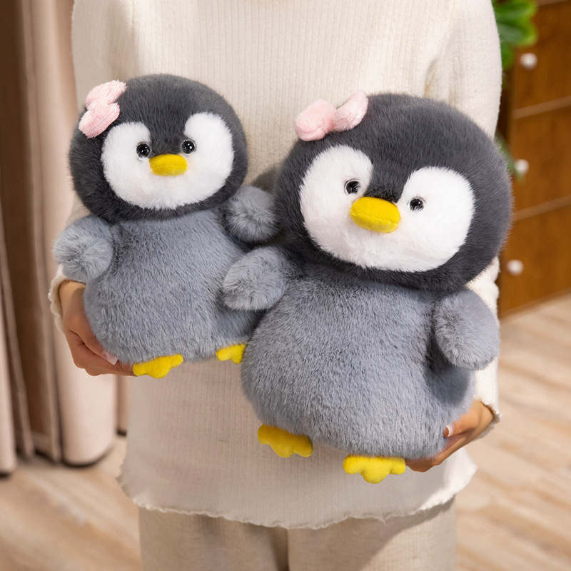 Bow penguin plush toys in two sizes with soft plush fabric