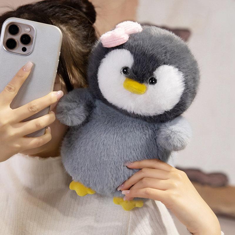 Bow penguin plush toy designed for hugging and cozy everyday comfort