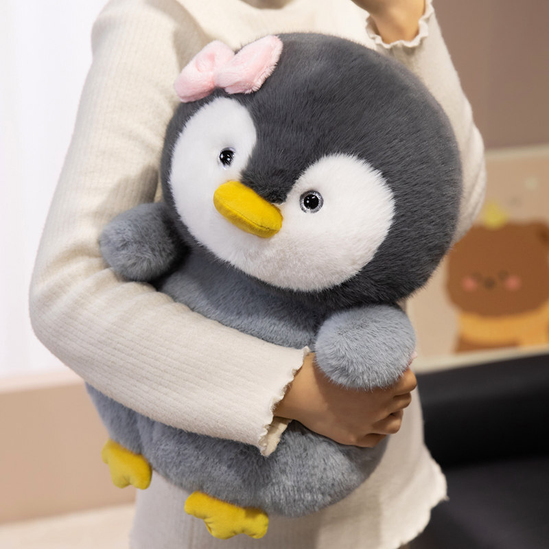 Bow penguin plush toy designed for hugging and cozy comfort