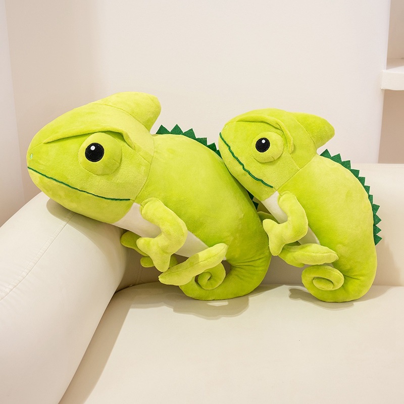 Green chameleon plush toy in two sizes displayed on a sofa, soft and cuddly design perfect for hugging, relaxing, and cozy home decor