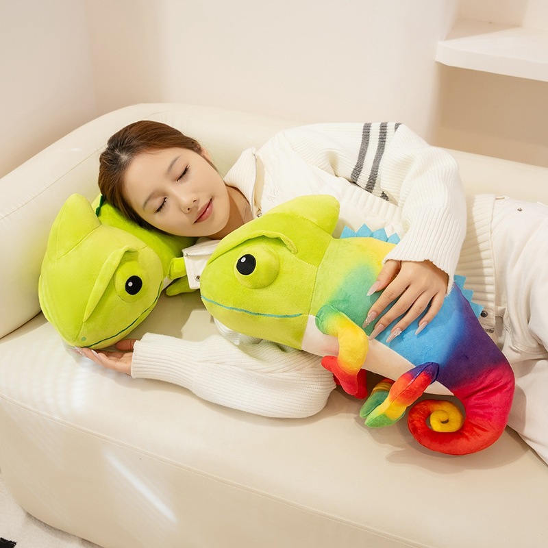 Colorful chameleon plush toy used as a soft hugging pillow on a sofa, showing cozy and relaxing home comfort