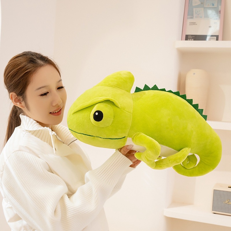 Green chameleon plush toy showing soft texture, size scale, and cuddling experience
