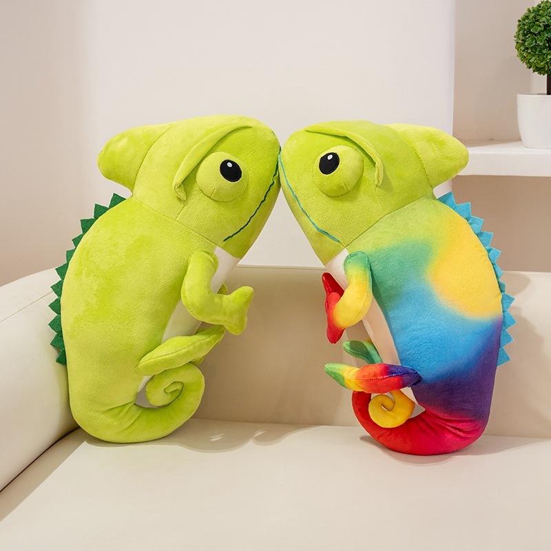 Colorful chameleon plush toys facing each other on a sofa, emphasizing cute design, soft plush fabric, and playful atmosphere