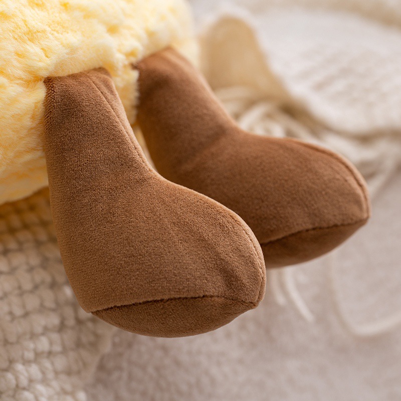 Soft plush moon pillow foot detail showing velvety fabric texture and fine stitching, highlighting cozy craftsmanship and huggable comfort for home decor and relaxation