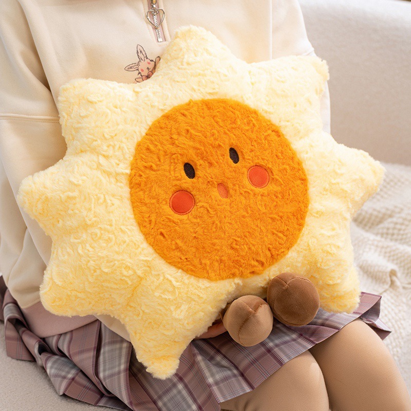 Healing sun plush pillow hugged close, soft plush cushion designed for comfort, warmth, and cozy relaxation at home