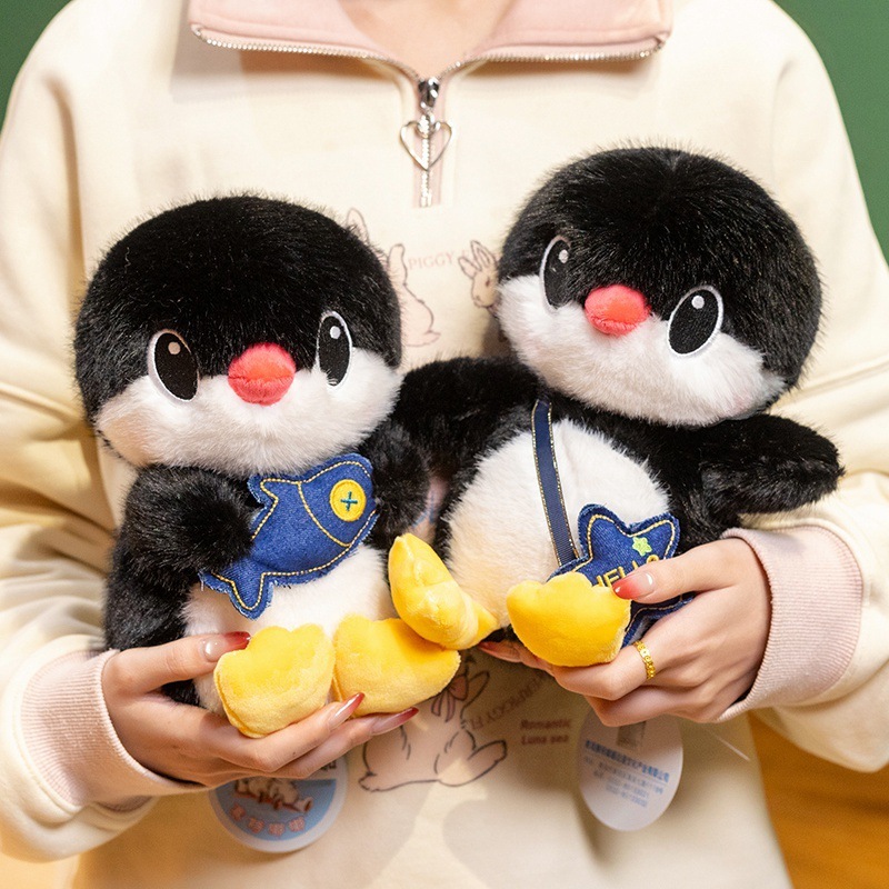 Penguin plush toys in fish and backpack styles, soft and huggable