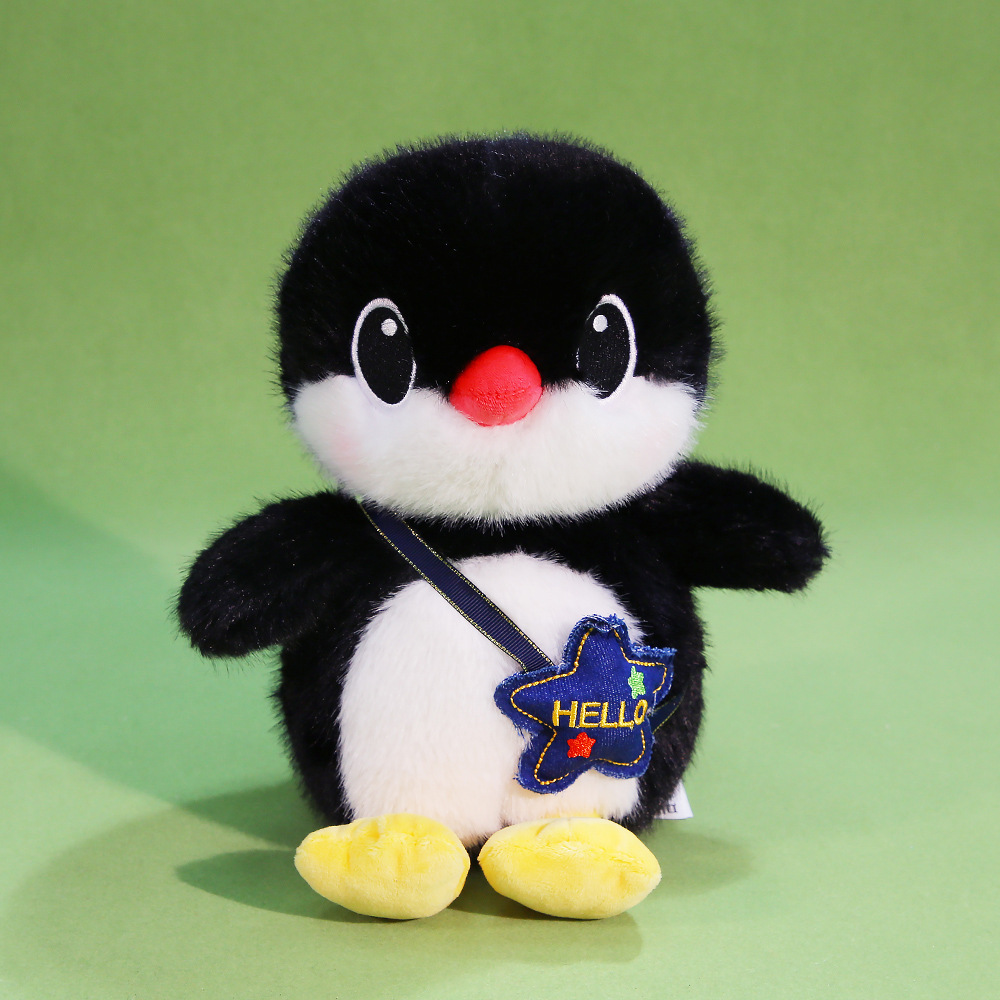 Penguin plush toy with backpack, soft stuffed animal with star-shaped pouch, cute home decor and gift