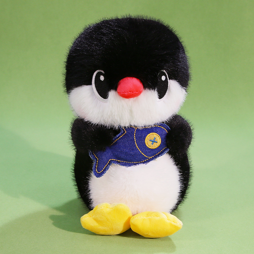 Penguin plush toy holding fish, soft stuffed animal with fluffy texture, cozy decor for shelves and beds