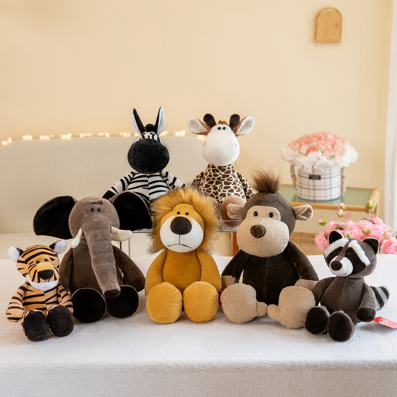 Jungle animal plush toys including lion giraffe elephant tiger raccoon zebra and monkey displayed together as soft stuffed animals for home decor and gifts