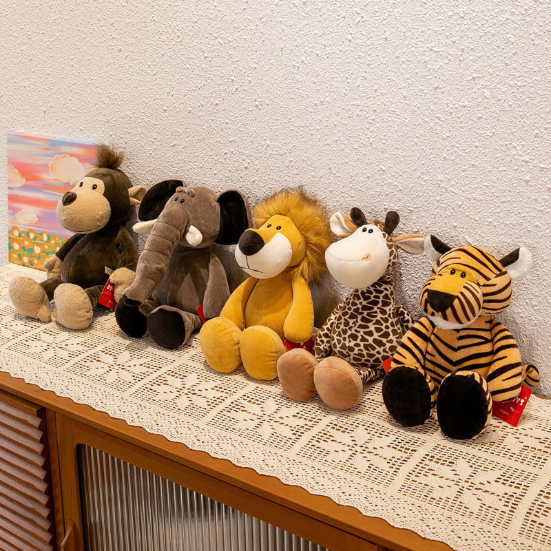 Jungle animal plush toys lined up on a cabinet, including elephant, lion, giraffe, tiger and monkey, suitable for shelf decoration, gifting, and cozy room styling