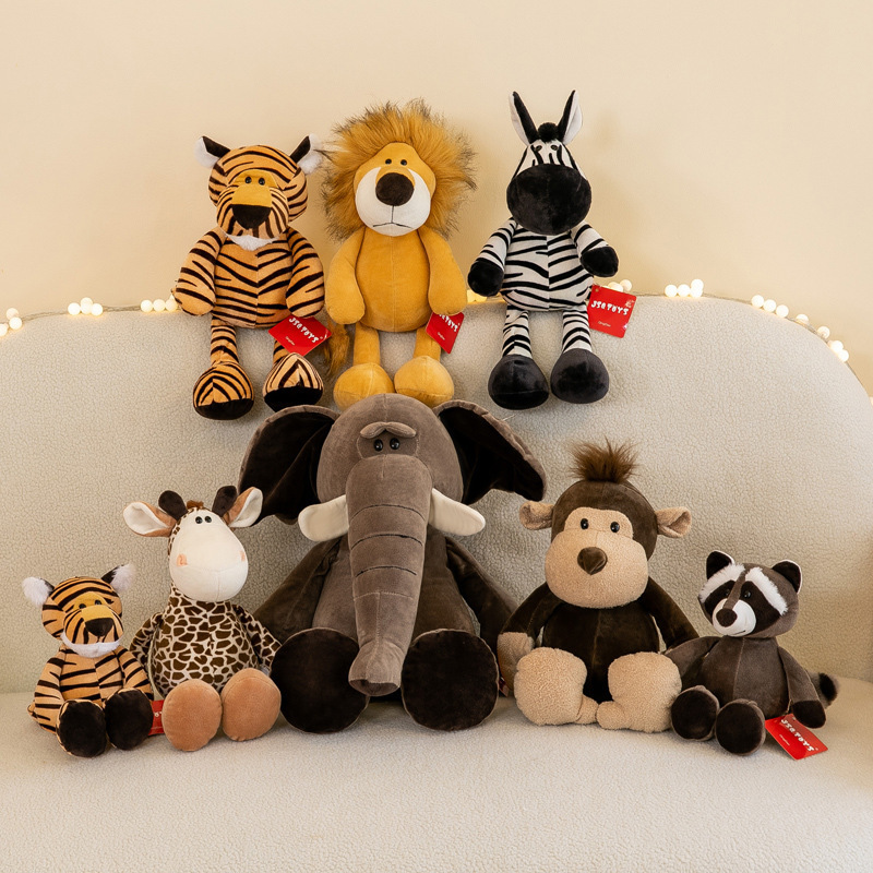 Jungle animal plush toys set featuring lion, elephant, giraffe, tiger, zebra, monkey and raccoon displayed together on a sofa in a cozy home setting