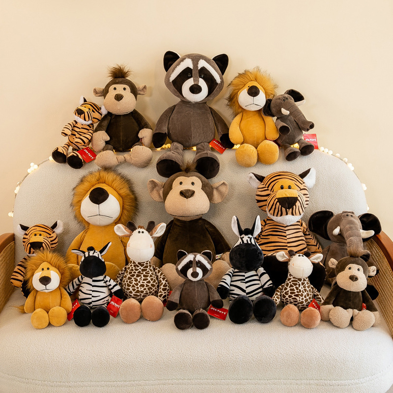Full jungle animal plush toy collection including lion, elephant, giraffe, tiger, zebra, monkey and raccoon arranged together for home decor and gifting