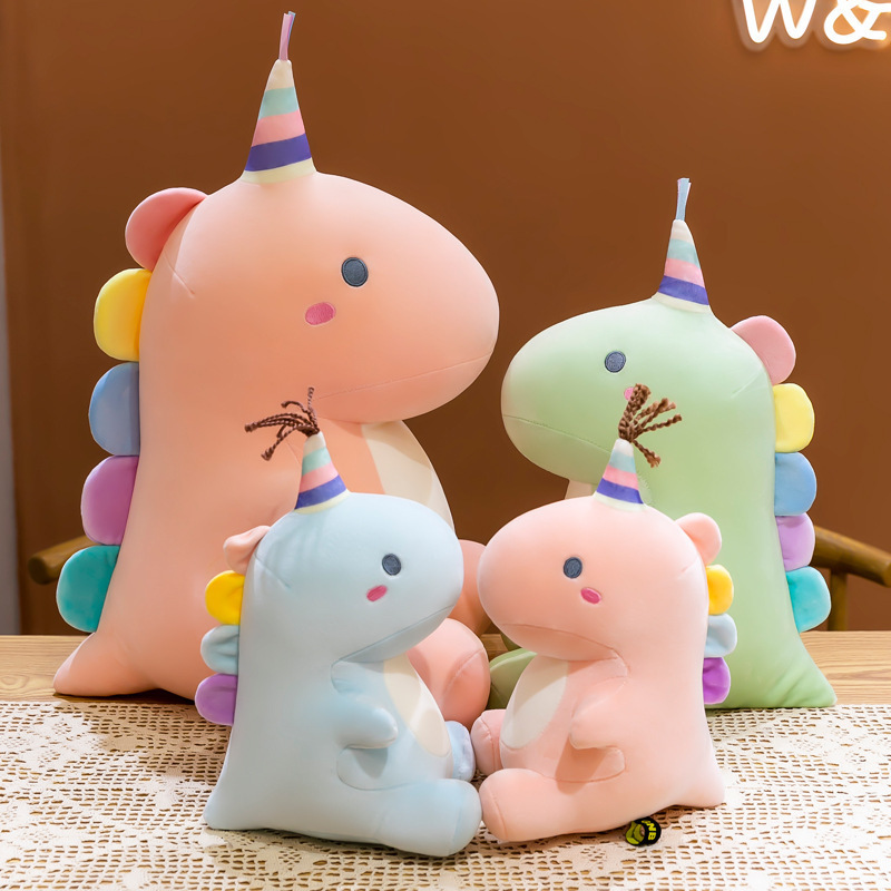 Candy dinosaur plush toys in pastel colors displayed together in multiple sizes, featuring soft plush fabric and cute decorative details, ideal for cozy home decor or gifting