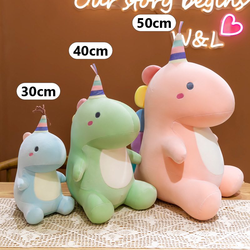 Candy dinosaur plush toy size comparison showing 30cm 40cm and 50cm options displayed upright on a table for scale reference