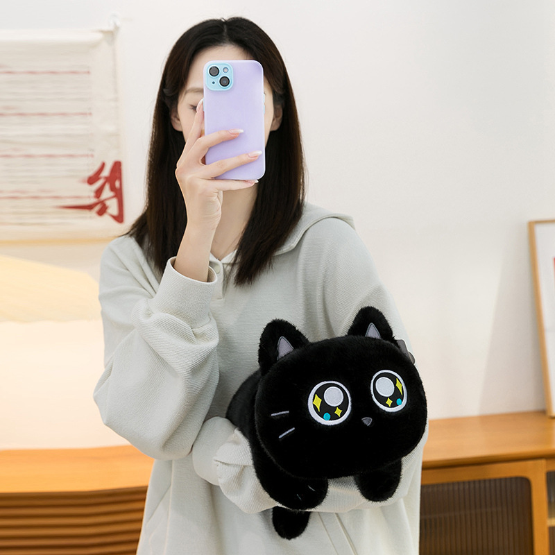 Soft lying cat plush toy held for everyday use, featuring a compact and rounded shape with smooth plush fabric, ideal for hugging, desk companionship, or relaxing at home