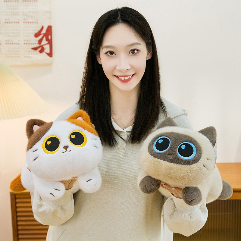 Soft lying cat plush toy held for size reference, featuring a compact and plush-filled design with a smooth texture, ideal for cuddling, desk companionship, or cozy home decor