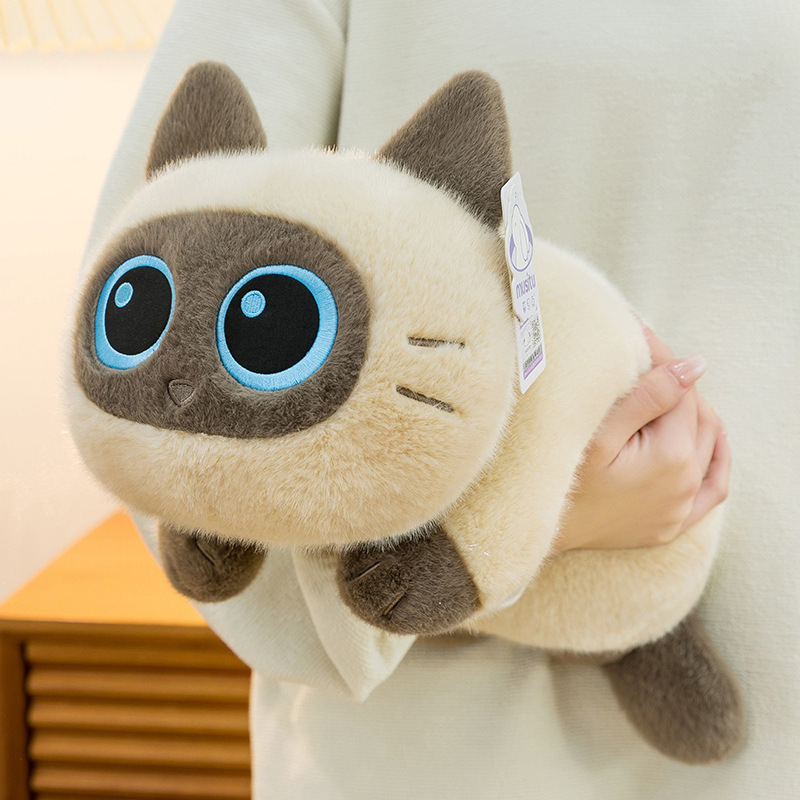 Soft lying Siamese cat plush toy with a fluffy, rounded body and smooth plush fabric, shown up close to highlight its cuddly texture and comfortable hugging feel