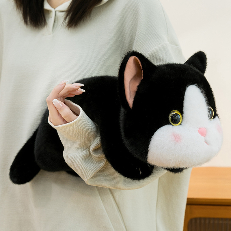 Soft lying cow cat plush toy with a floppy body and smooth plush texture, shown as a cozy companion that fits comfortably in arms for relaxing and everyday comfort