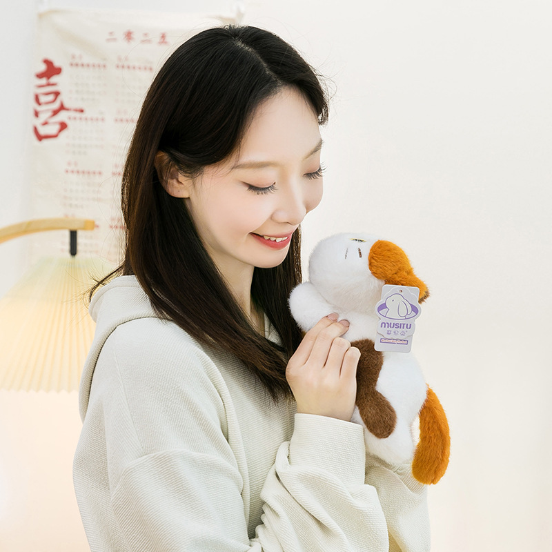 Soft lying calico cat plush toy held close, showing fluffy texture and gentle details, designed for comforting hugs and cozy everyday companionship