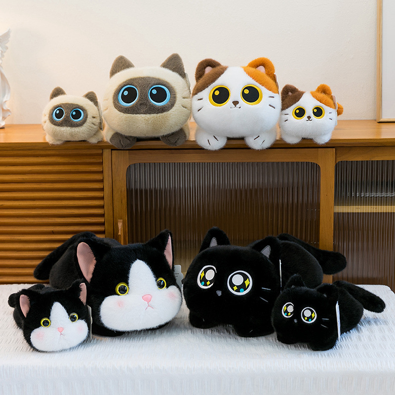 Soft lying cat plush toys in multiple colors and sizes displayed together, showing size variations and cute designs for cozy home decor