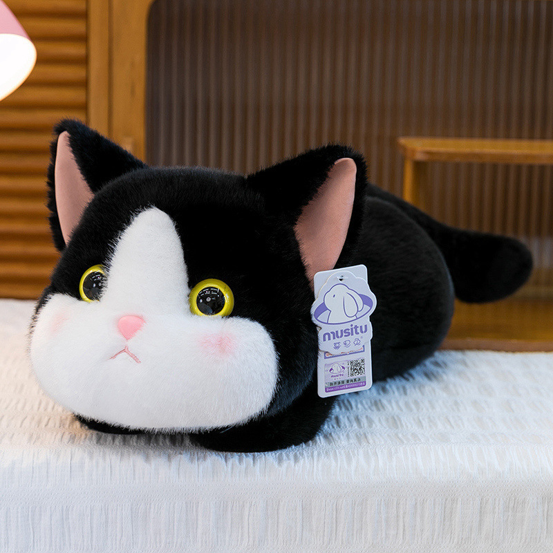 Soft lying cat plush toy in cow cat color with floppy body