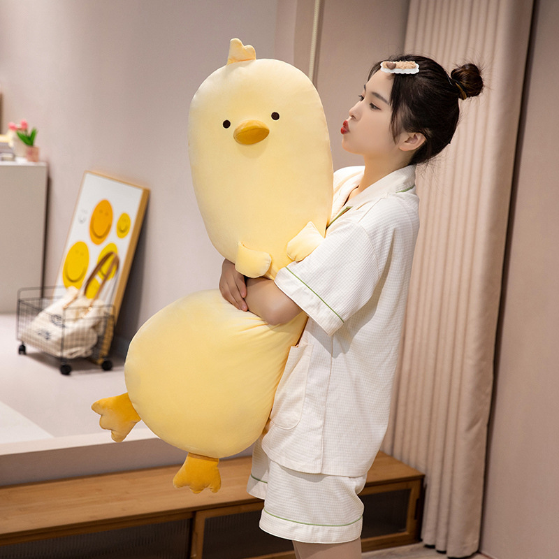 Milk chick plush pillow held upright to show long body size and thickness, soft plush fabric with full-body cushioning, ideal for hugging, relaxing, and cozy home comfort or bedroom decor
