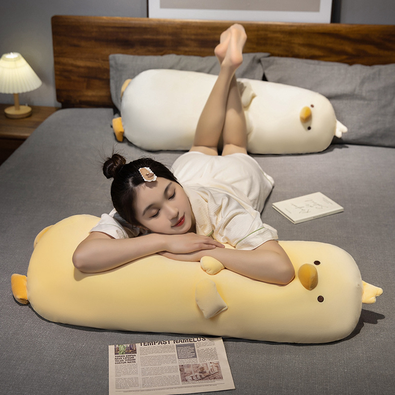 Milk chick plush pillow for sleeping and hugging, long chicken body pillow with soft plush texture, ideal for full body support, relaxation, and cozy bedtime comfort on bed