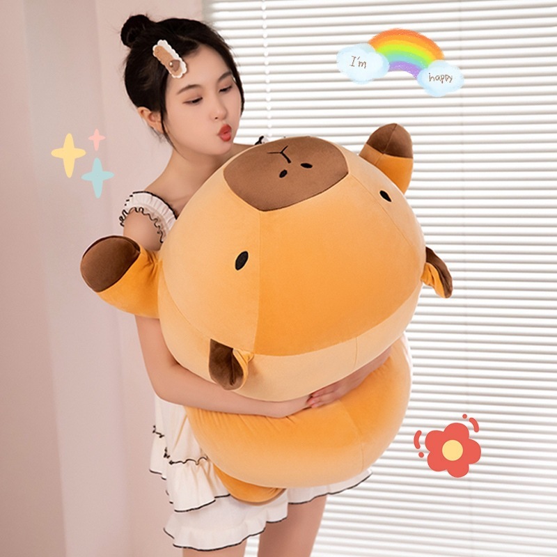 Large capybara plush pillow held in arms, showing soft fabric, rounded shape, and full body size, ideal for hugging, relaxing, and cozy home decor