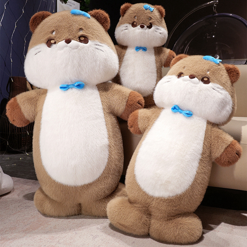 Sea otter plush toys displayed together in a cozy living room setting, showing soft plush texture, rounded shape, and upright design for hugging and home decor