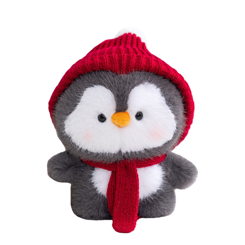 Coco standing penguin plush toy wearing red knit hat and scarf, soft stuffed animal with fluffy plush texture, cute winter style plush for display or gifting