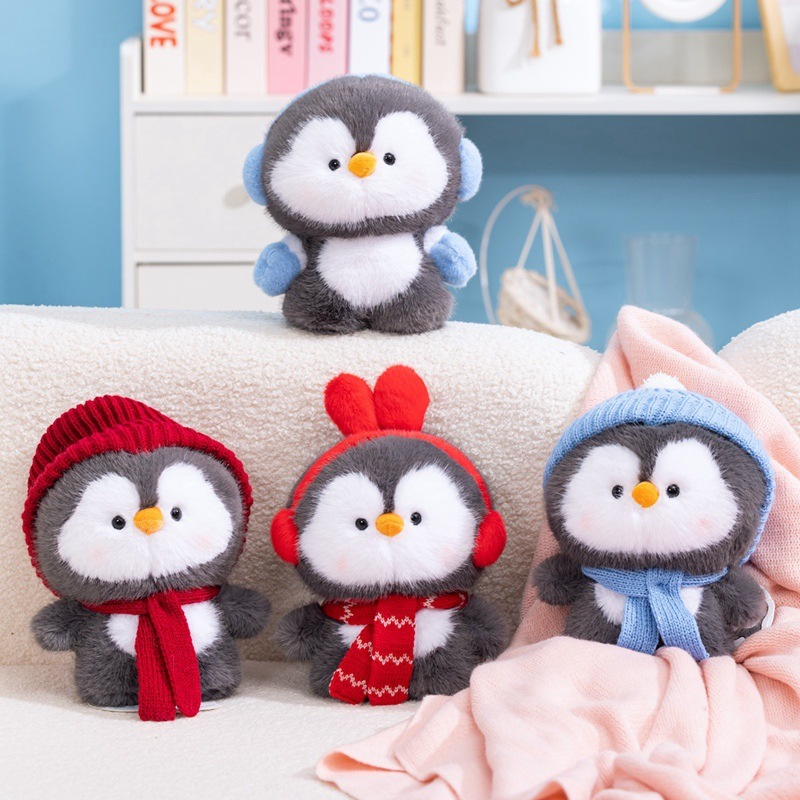 Coco standing penguin plush toy collection with ear muffs and hats, soft stuffed penguin dolls arranged on a sofa, cute plush toys for cozy home decor and gifting