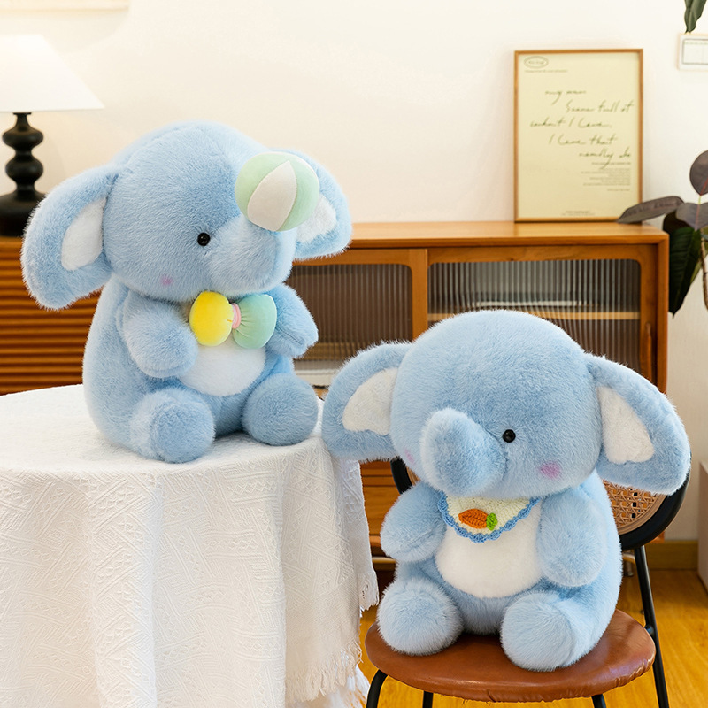 Happy elephant plush toys placed on a table and chair in a cozy living space, highlighting their soft, huggable form, gentle colors, and warm home decor atmosphere as comforting plush companions