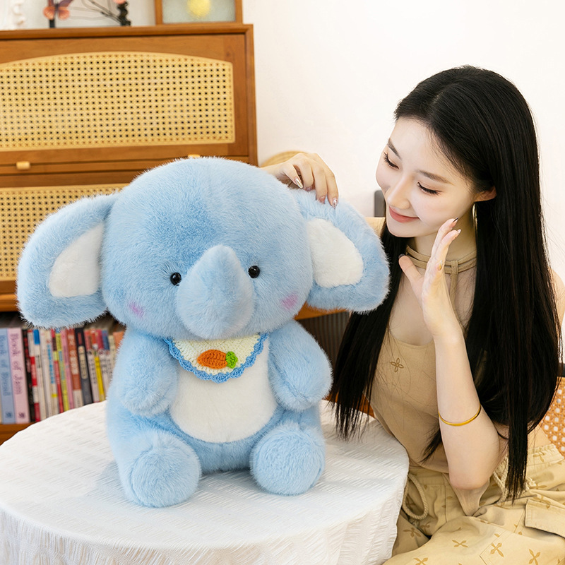 Happy elephant plush toy displayed on a table, highlighting soft plush texture, gentle blue color, and a calming, cozy home atmosphere
