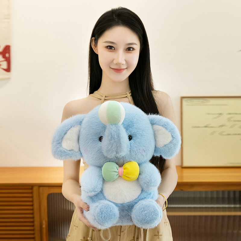 Happy elephant plush toy in 35cm size featuring soft blue plush texture, sitting pose and gentle pastel bow, suitable for daily companionship, sofa decoration and cozy room styling