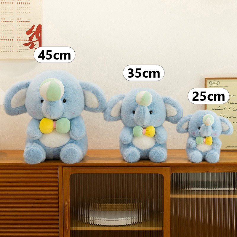 Happy elephant plush toy size comparison showing 25cm, 35cm, and 45cm options displayed side by side on a cabinet
