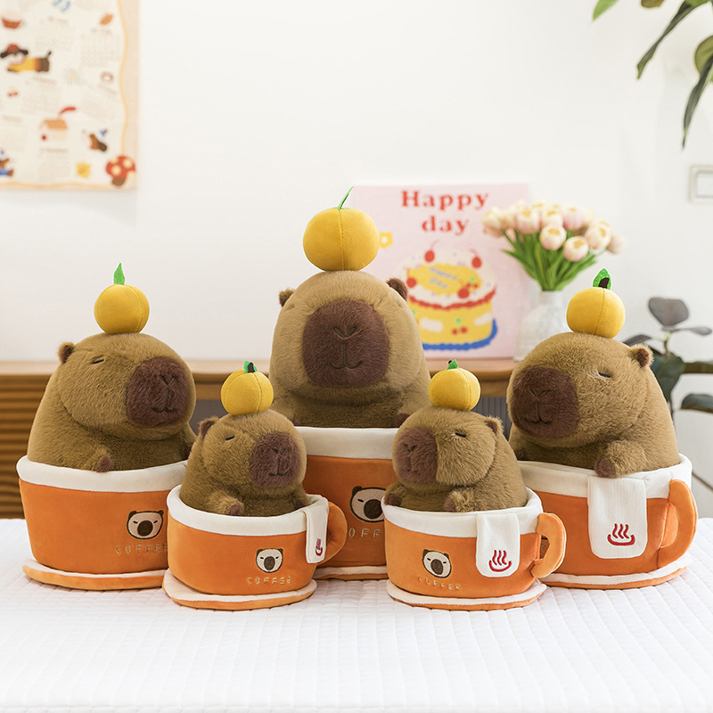 Coffee cup capybara plush toy set in multiple sizes displayed inside orange coffee cups