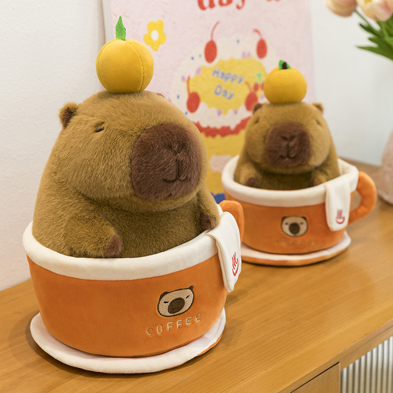 Coffee cup capybara plush toy displayed on shelf with removable capybara and cup