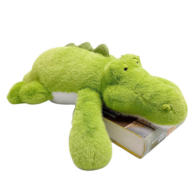 Lying crocodile plush toy green soft stuffed alligator on white background
