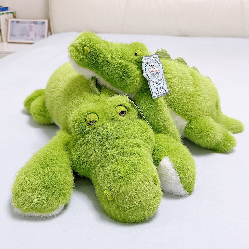 Green lying crocodile plush toy stacked together showing soft plush texture and cute alligator design