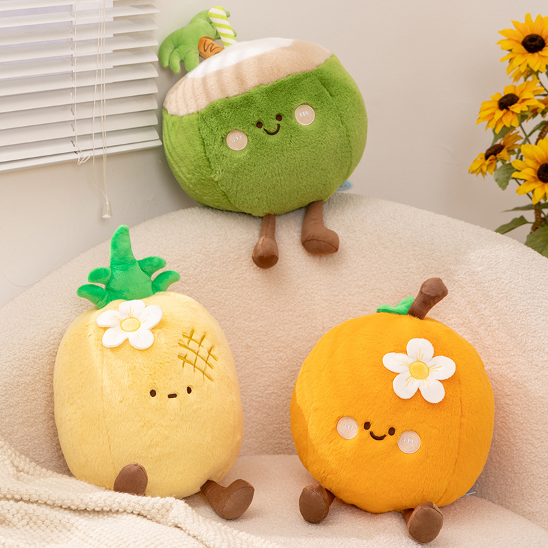Cute fruit plush pillows including coconut, pineapple and orange displayed on sofa