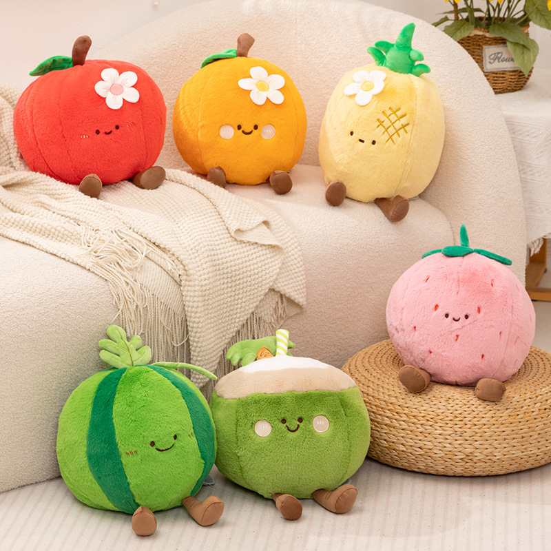 Cute fruit plush pillows including apple, orange, pineapple, strawberry, coconut and watermelon displayed on sofa
