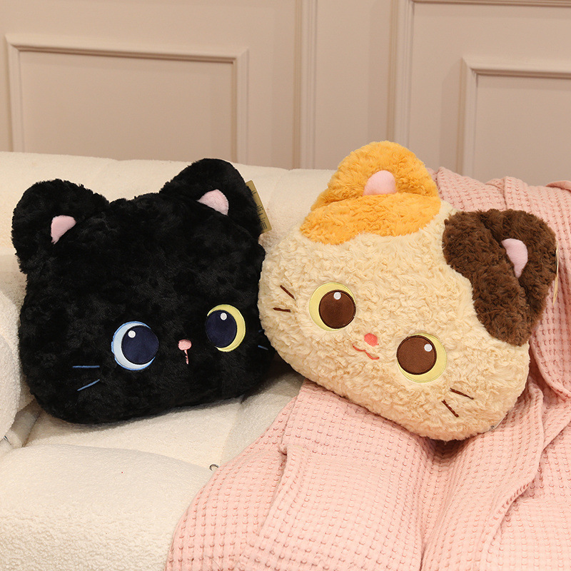 Calico and black cat head plush pillows displayed on a sofa, soft kitty face cushions for cozy living room decor