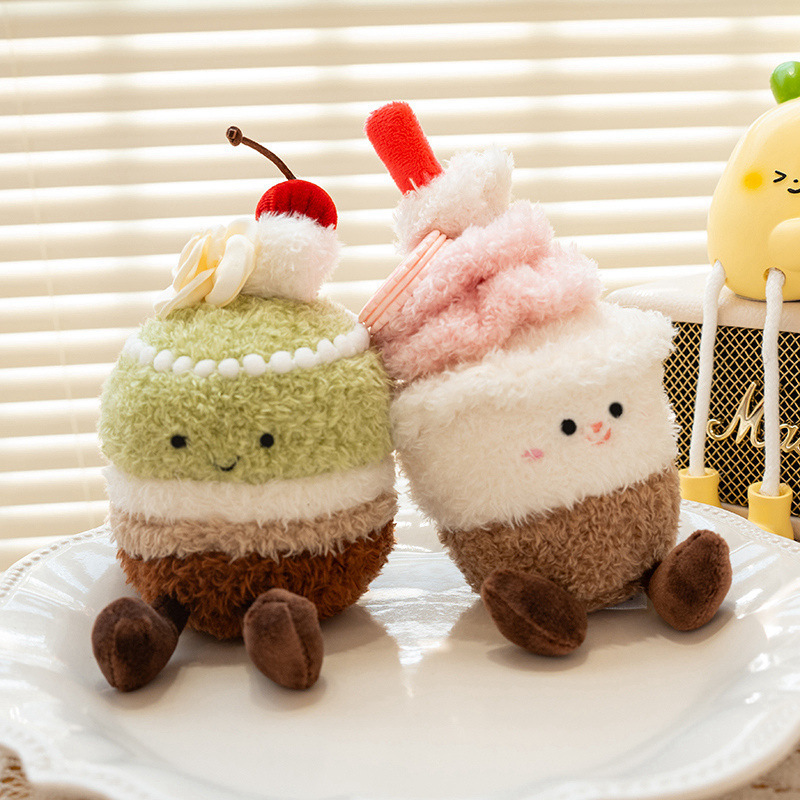 Matcha cake and cupcake plush toys placed on a plate by the window, cute dessert stuffed animals for home decor, display, and gift ideas