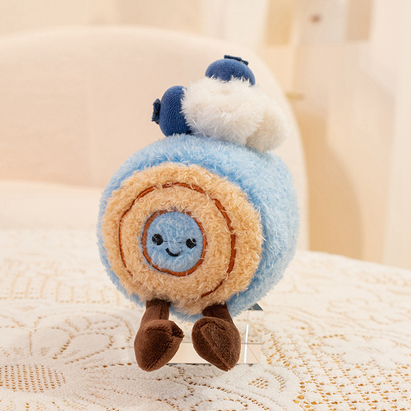 Blueberry Swiss roll dessert plush toy in blue roll shape with cream swirl detail and tiny legs, cozy stuffed decoration for desks, shelves or gift giving