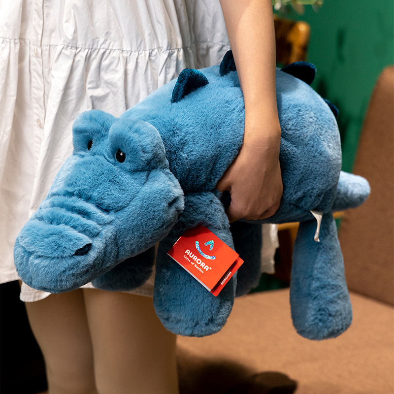 Aurora lazy lying crocodile plush toy in soft blue fabric with extended body, lightweight and perfect for hugging or bedtime comfort