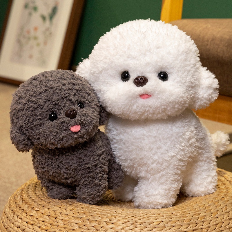 Gray and white Bichon Frise plush toys with curly teddy plush texture displayed on a woven mat in a cozy home setting