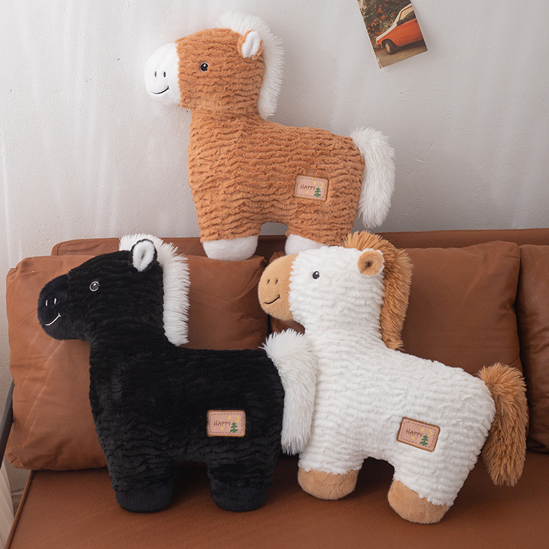 Horse plush pillow in white, brown, and black displayed on a sofa, soft animal cushion for cozy home decor and hugging