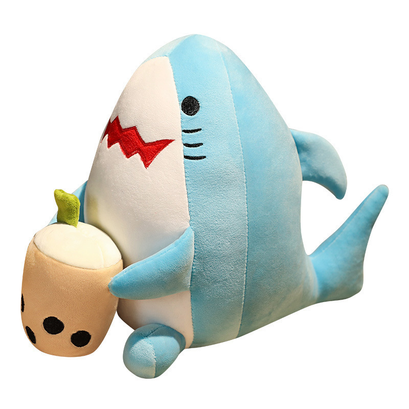Shark milk tea animal plush toy in soft blue plush fabric holding a bubble tea cup, isolated on a white background