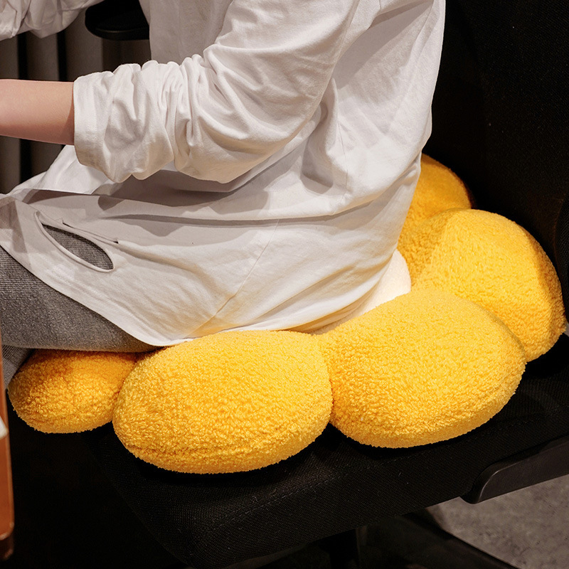 Sunflower plush seat cushion on office chair, thick padded petals with soft fluffy texture for comfortable seating and pressure relief